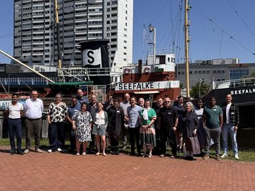 DSM / Lisanne Rinke Participants in front of museum ship in Bremerhaven